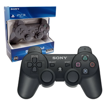 Sony PlayStation 3 gaming controller with packaging on a white background