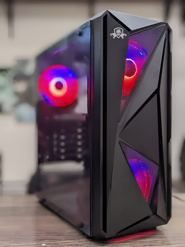 Glossy black computer case with RGB lighting on a blurred background