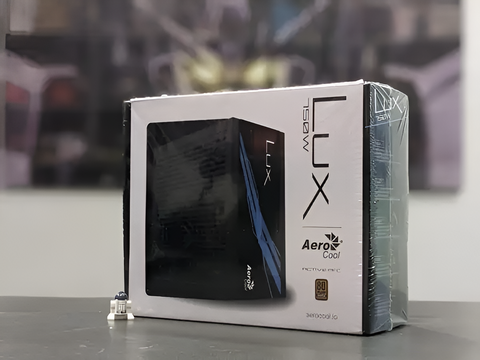 Box of AeroCool LUX product on a reflective surface with a blurred background