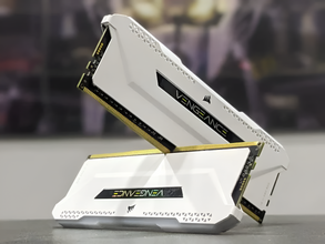 Corsair Vengeance RAM modules on a stand with a blurred background