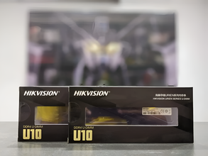 Two Hikvision U10 boxes on a reflective surface with a blurred background