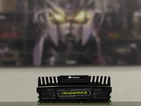 Corsair Vengeance RAM module on a blurred background with a character in the background