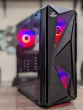 Black gaming computer case with RGB lighting on a wooden surface