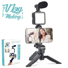 Video-making kit with smartphone holder, microphone, and stand on a white background