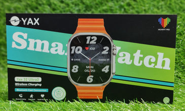 Smartwatch on a branded YAX display card against a grass background