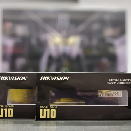 Two Hikvision U10 boxes on a reflective surface with a blurred background