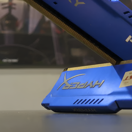 Close-up of a blue and gold computer memory module with HyperX branding.