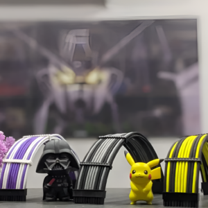 Toy figures of Darth Vader and Pikachu with colorful arches on a blurred background
