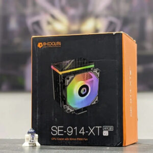 CPU cooler packaging with colorful fan design on a blurred background