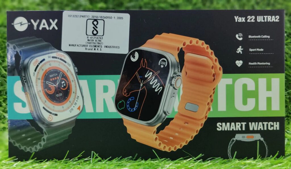 YAX smart watch packaging with two different watch faces on a grass background